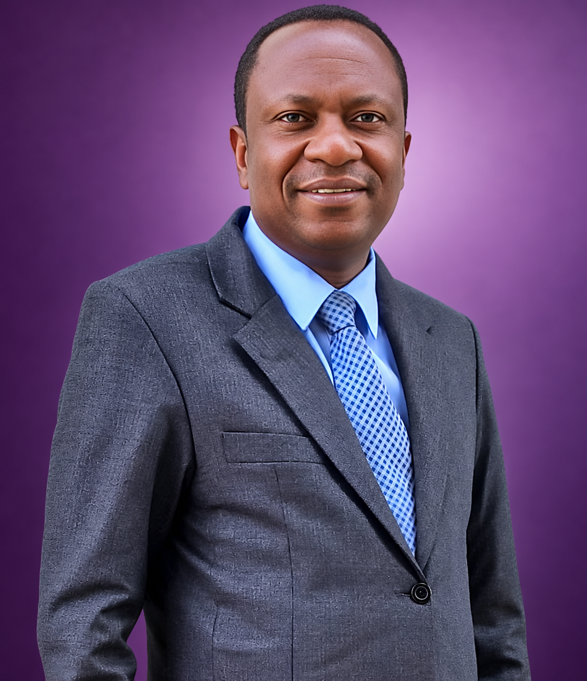 Rev. Abraham Ayiakwo wearing a grey suit and blue tie